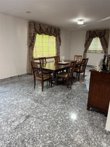 a kitchen with granite countertop a stove a sink and a microwave