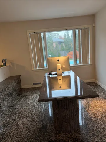 a room with furniture and a flat screen tv