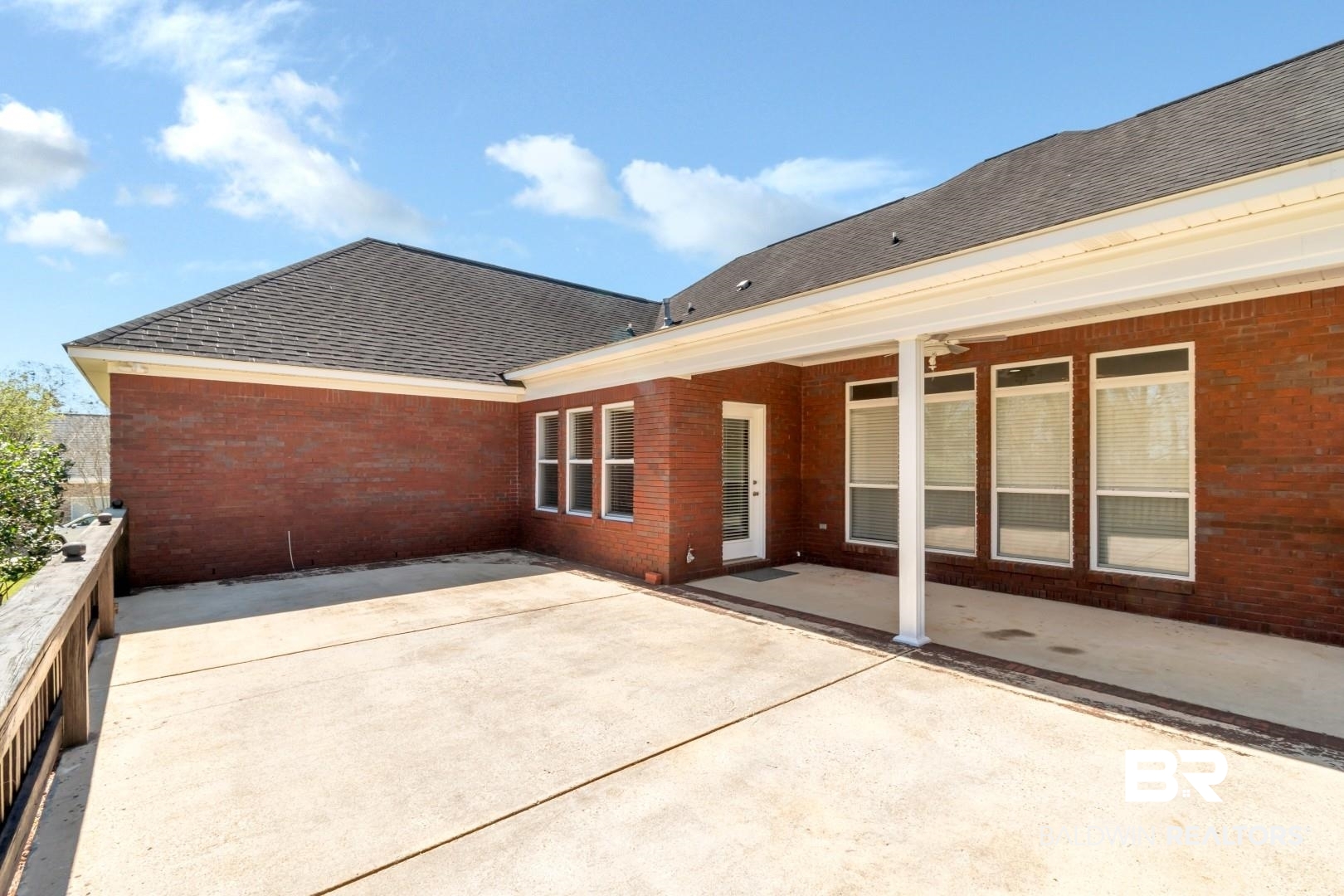 6090 Celeste Road Saraland, AL 36571 - Photo 35 of 38 Rear view of property featuring brick siding, roof with shingles, and a patio