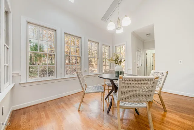 a kitchen with a sink cabinets and wooden floor
