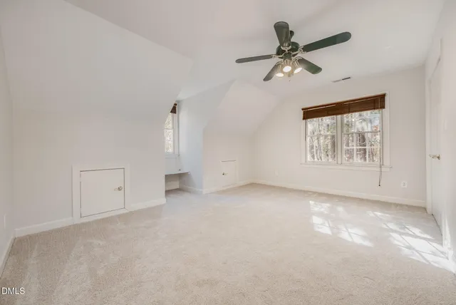 a view of a hallway with windows