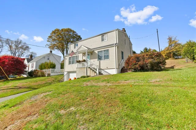 a view of a house with a yard