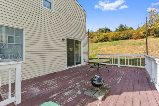 a view of balcony with wooden floor and seating space