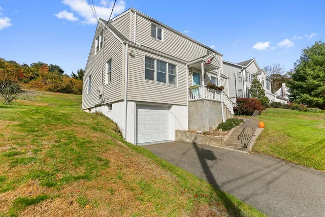 a front view of a house with garden
