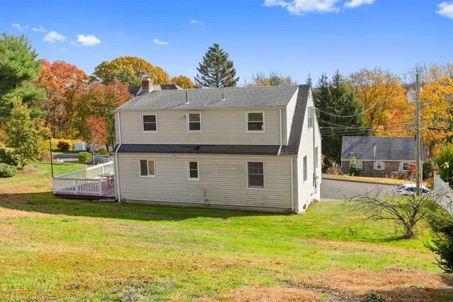 a view of a house with a backyard
