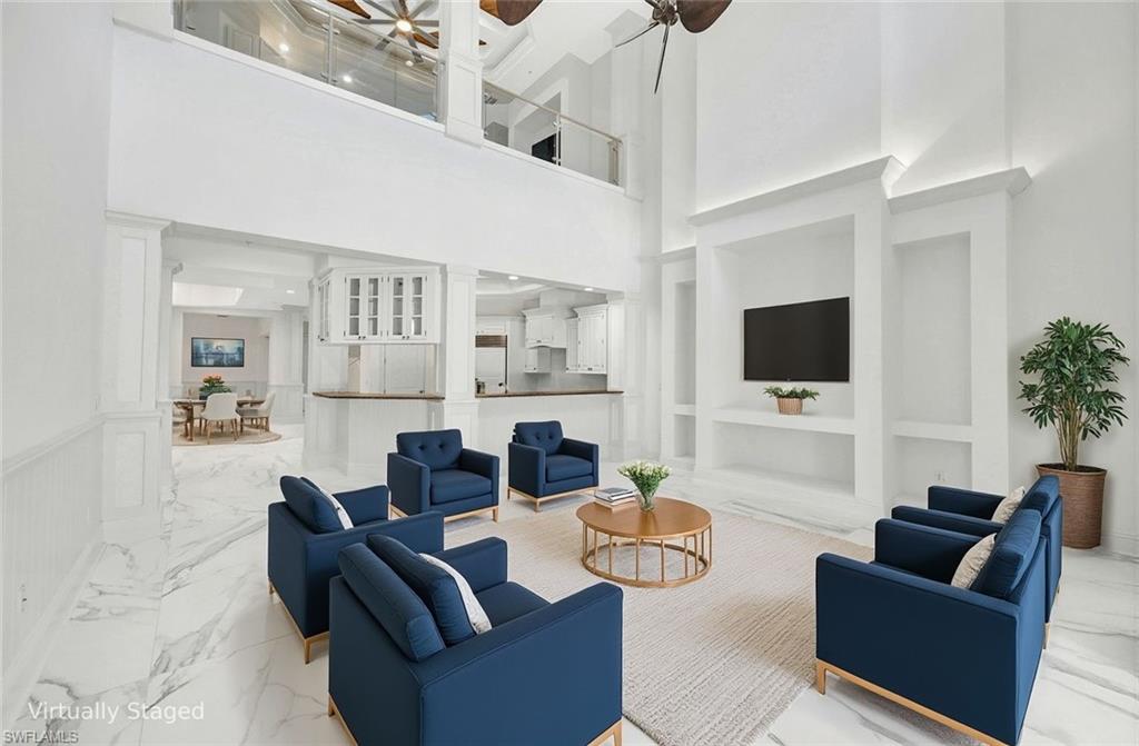 699 Fairway Terrace Naples, FL 34103 - Photo 14 of 46 a living room with furniture and a flat screen tv