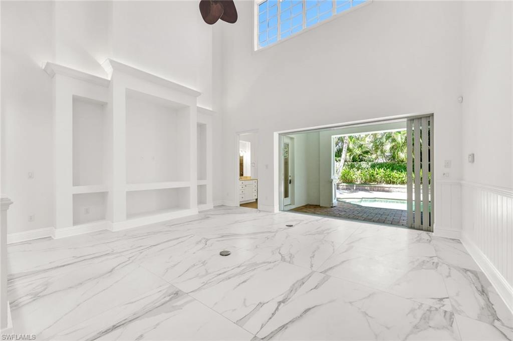 699 Fairway Terrace Naples, FL 34103 - Photo 15 of 46 a view of an empty room with a window