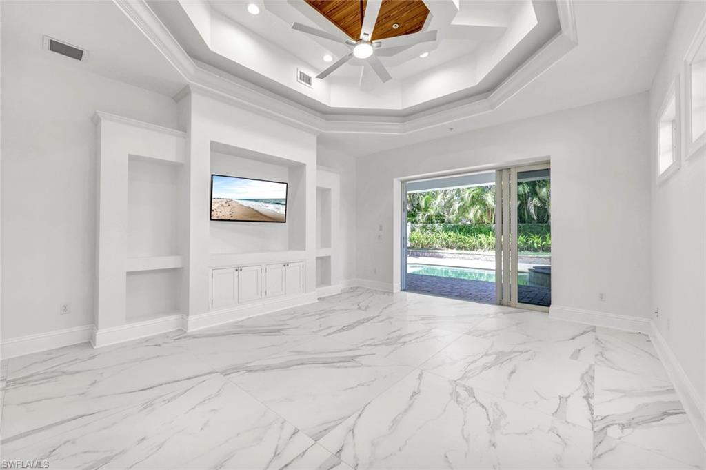 699 Fairway Terrace Naples, FL 34103 - Photo 17 of 46 a view of an empty room with a window