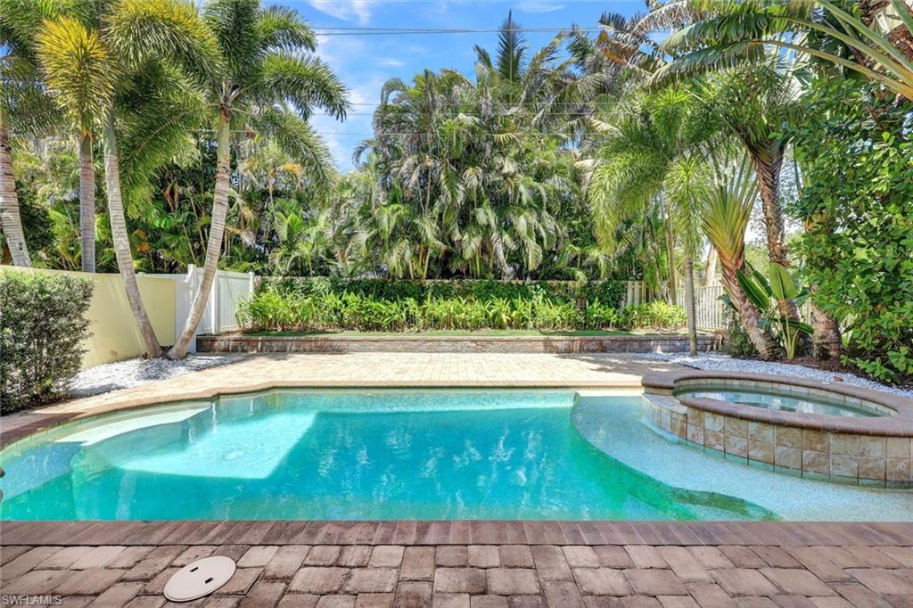 699 Fairway Terrace Naples, FL 34103 - Photo 38 of 46 a view of a swimming pool with a yard