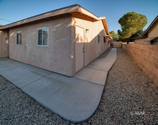 324 West Ward Avenue Ridgecrest, CA 93555 - Photo 22 of 32 a view of a house with a backyard