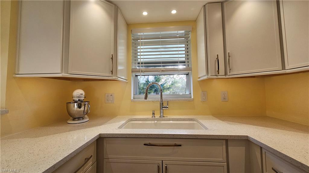 301 6th Avenue South, Unit D Naples, FL 34102 - Photo 18 of 29 Upper Cabinets and Kitchen Window