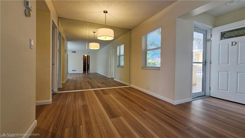 301 6th Avenue South, Unit D Naples, FL 34102 - Photo 7 of 29 Living Room w/Entry vestibule on the right