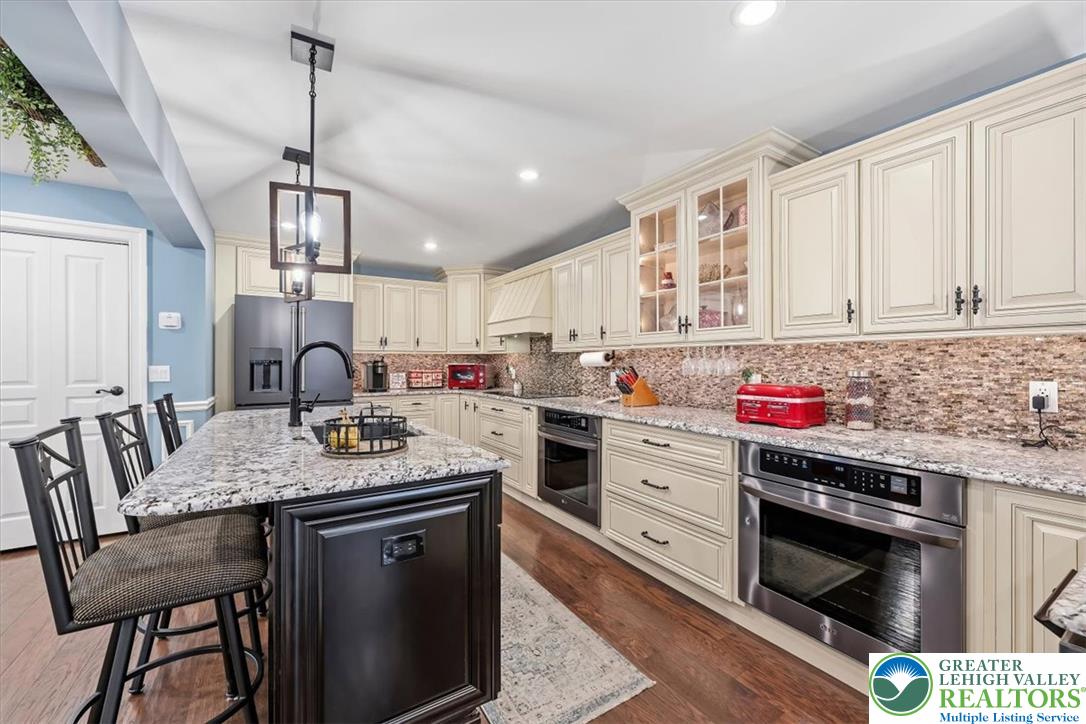 3771 State Road Coopersburg, PA 18036 - Photo 15 of 37 Gleaming granite countertops pair beautifully with classic cabinetry and durable hardwood flooring in this kitchen.
