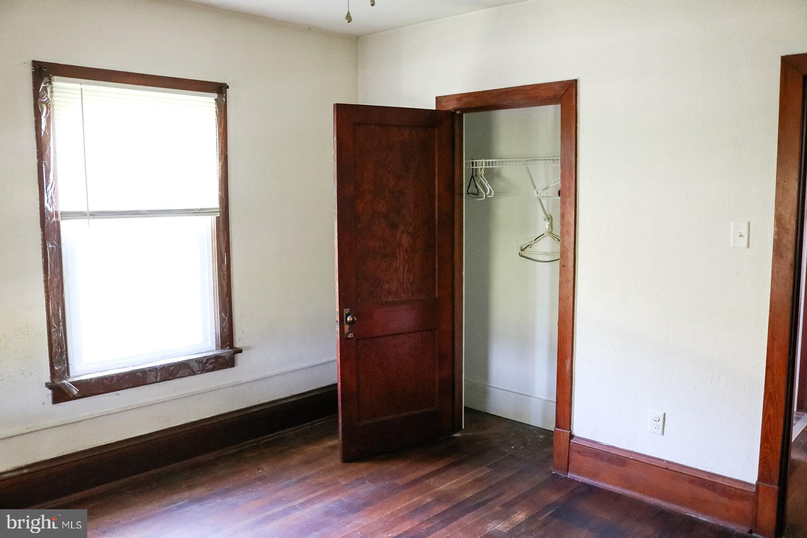 1508 Market Street Schellsburg, PA 15559 - Photo 15 of 24 a view of an empty room with wooden floor and a window