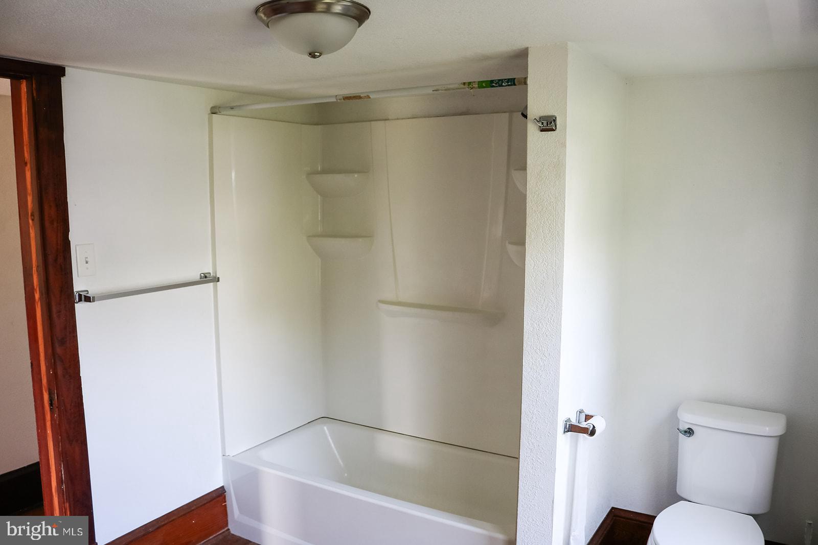 1508 Market Street Schellsburg, PA 15559 - Photo 17 of 24 a bathroom with a shower and a toilet