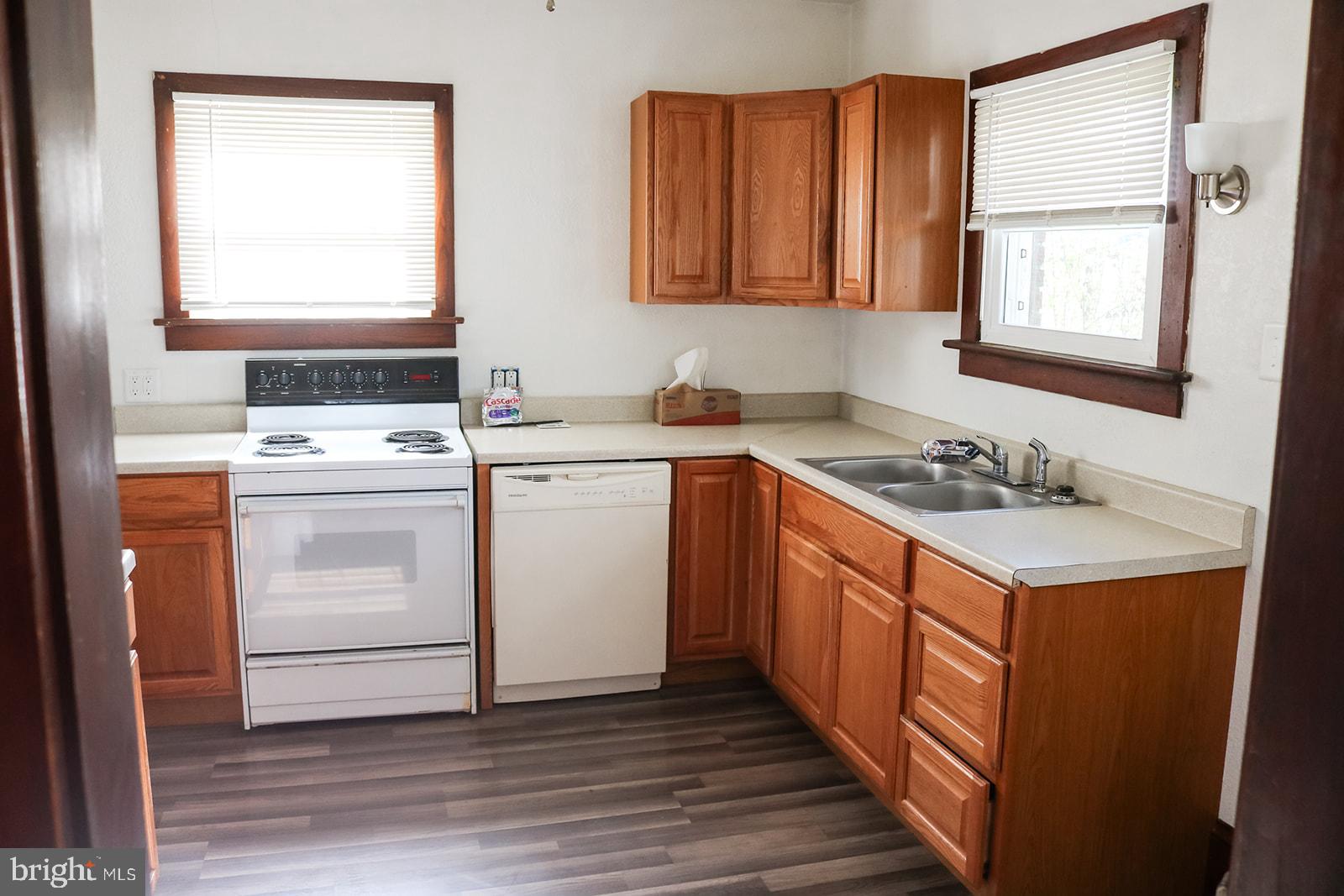 1508 Market Street Schellsburg, PA 15559 - Photo 5 of 24 a kitchen with a stove sink and cabinets
