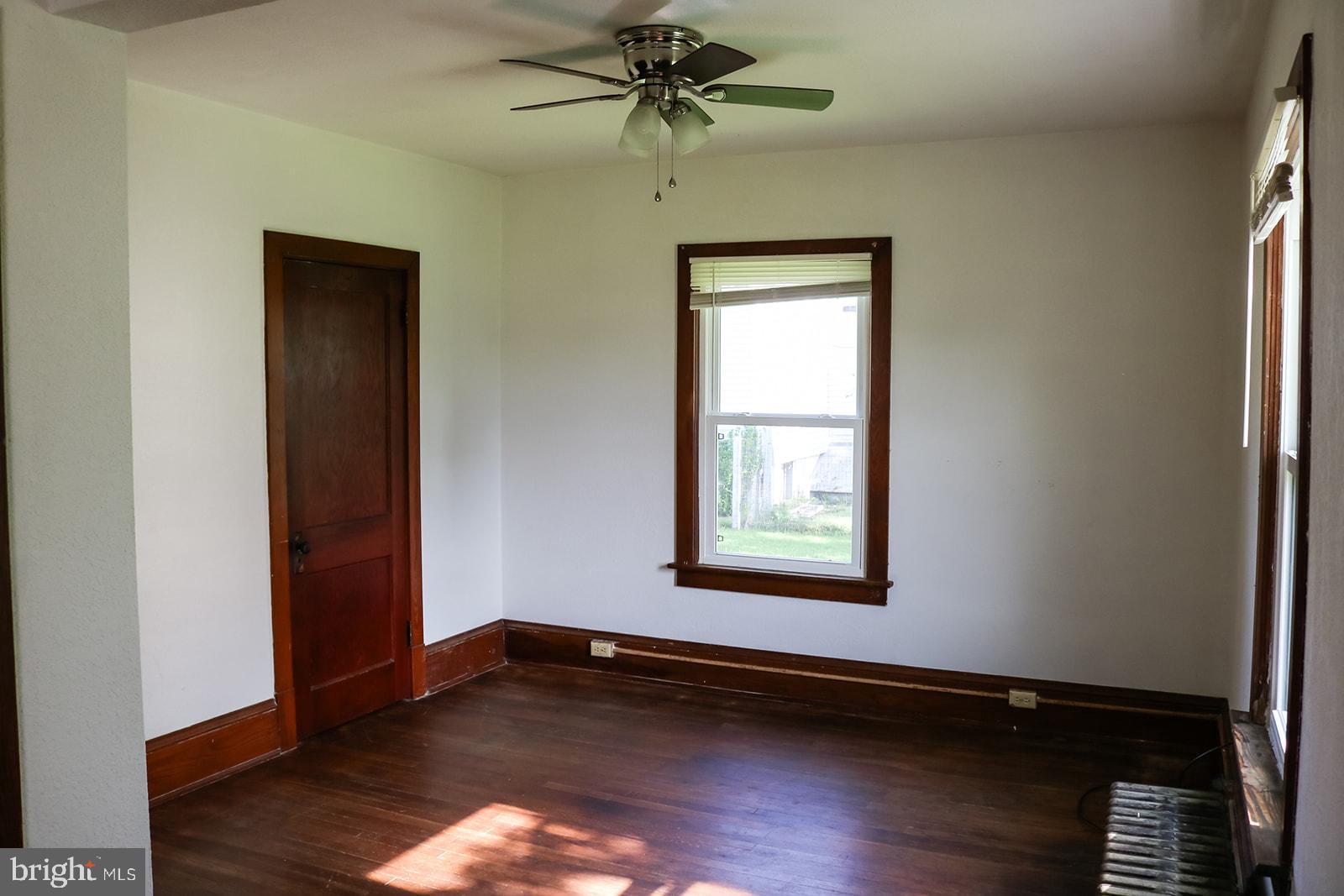 1508 Market Street Schellsburg, PA 15559 - Photo 9 of 24 an empty room with wooden floor closet and windows