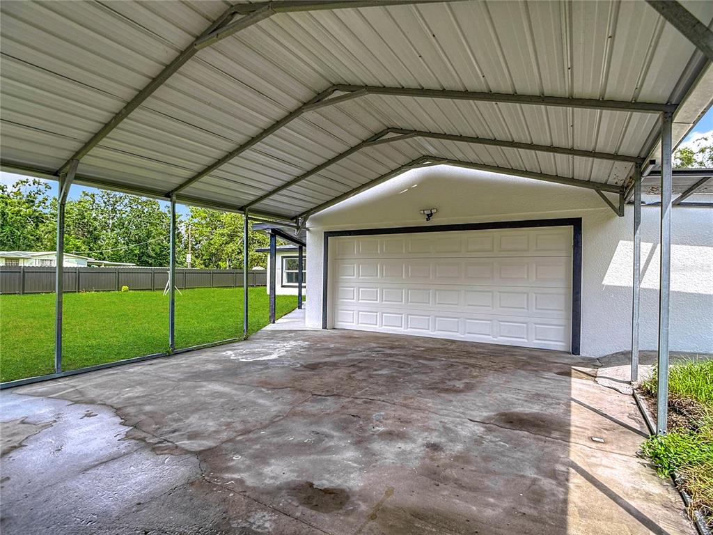 2402 East 148th Avenue Lutz, FL 33549 - Photo 11 of 71 a view of a house with backyard and porch