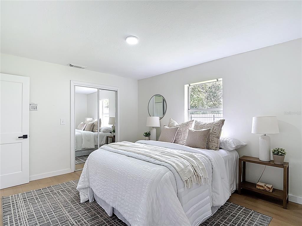 2402 East 148th Avenue Lutz, FL 33549 - Photo 37 of 71 a bedroom with a bed and a window