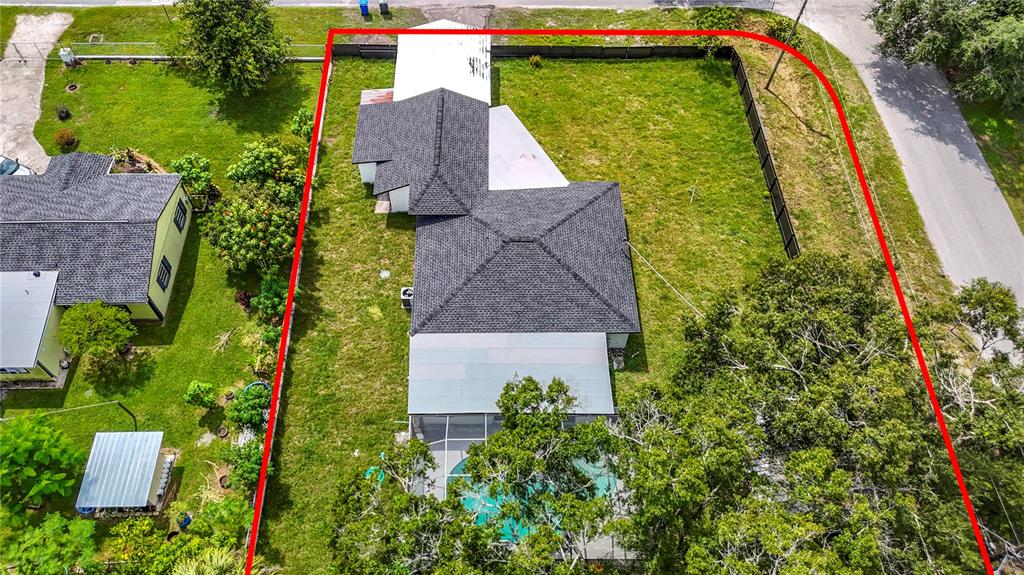 2402 East 148th Avenue Lutz, FL 33549 - Photo 69 of 71 an aerial view of a house with a garden