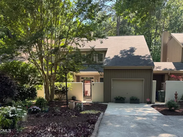 a front view of a house with yard