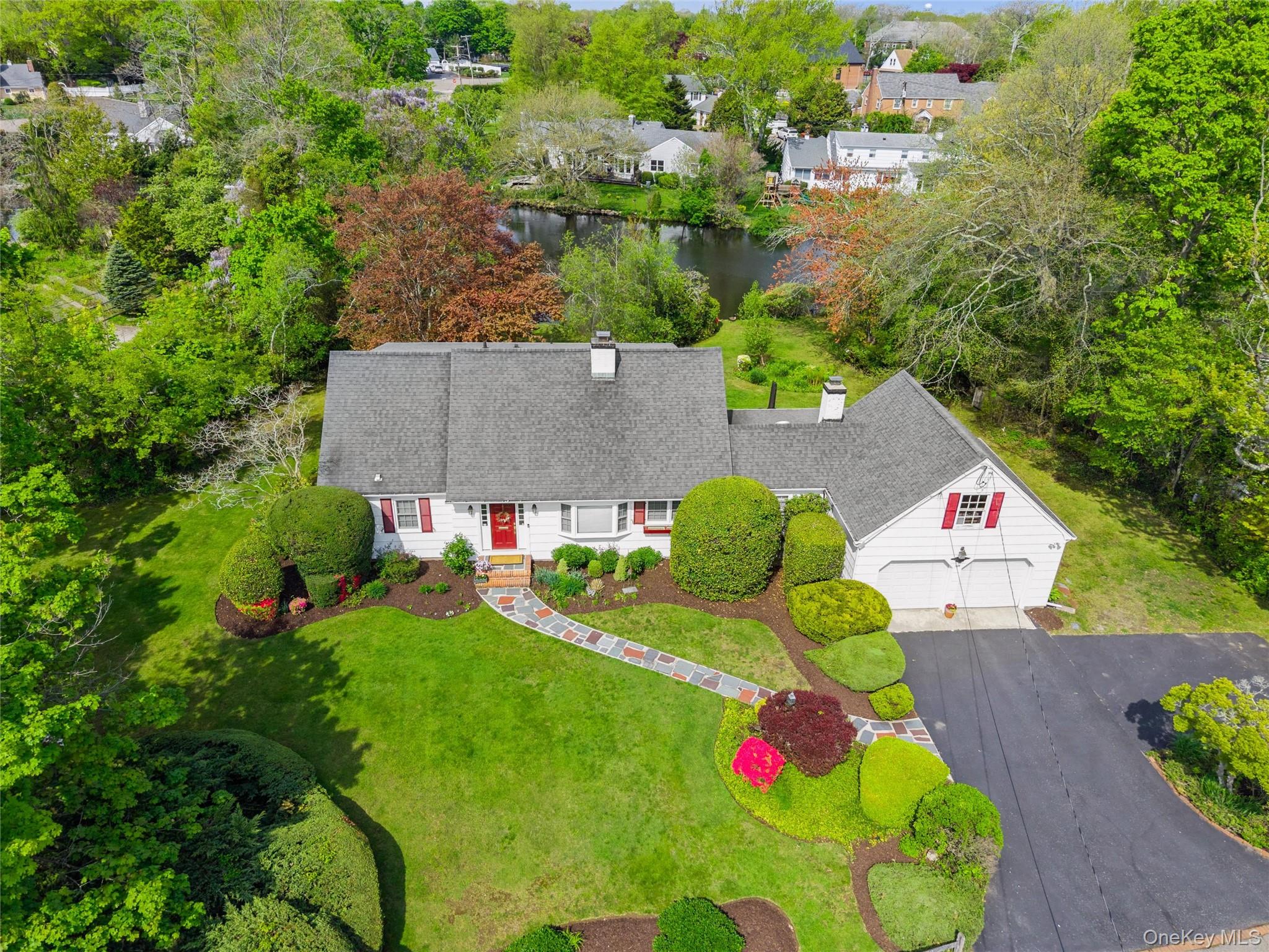 50 Belton Road Babylon, NY 11702 - Photo 28 of 34 Front of house has ample parking and pond in backyard.