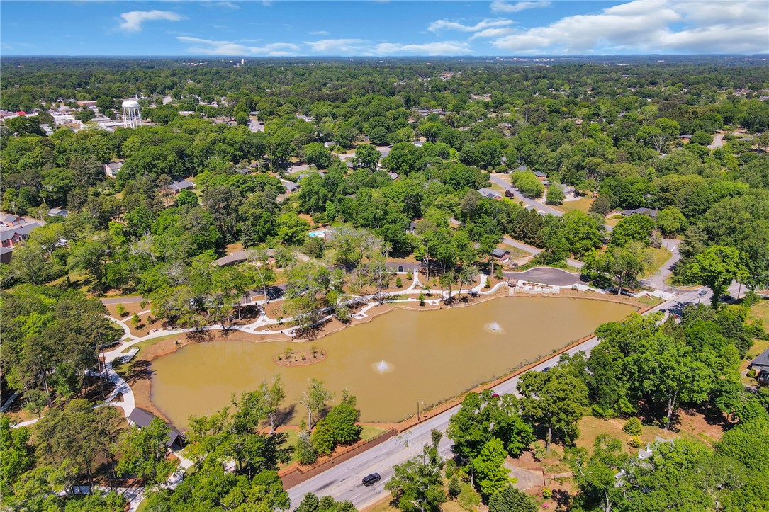 1107 Springdale Road Anderson, SC 29621 - Photo 48 of 49 This aerial view showcases a vibrant community nestled around a serene lake, perfect for outdoor enjoyment.