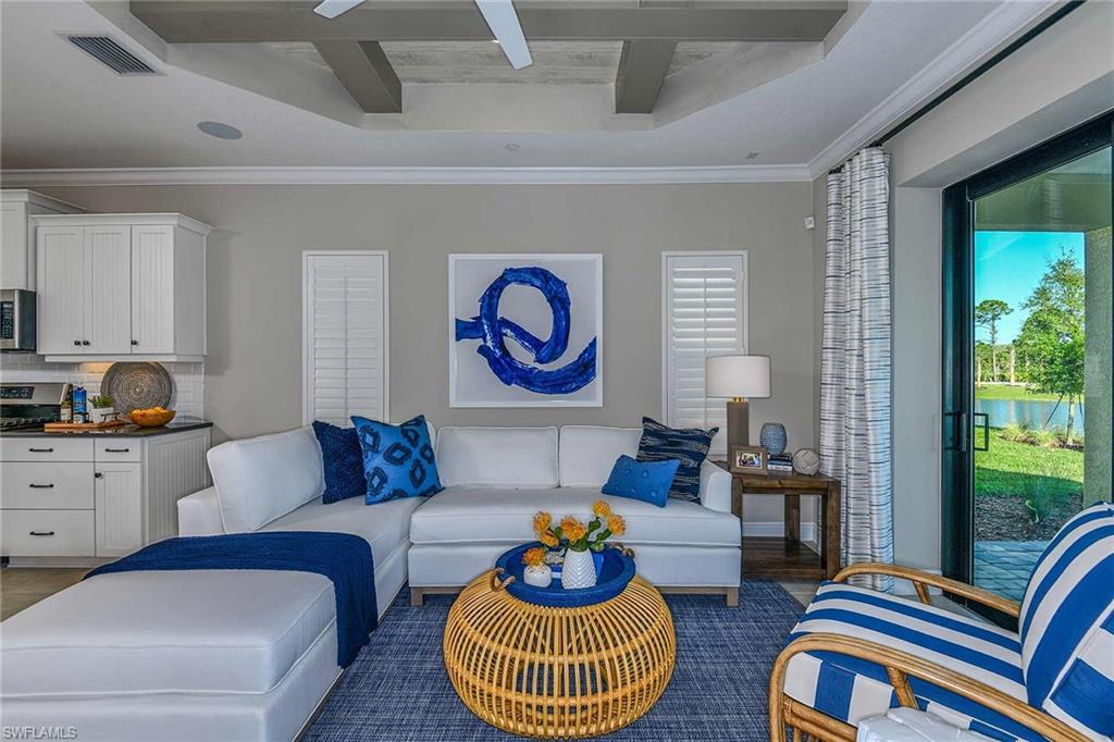 4671 Centaurus Circle Naples, FL 34120 - Photo 11 of 21 a living room with furniture and a window