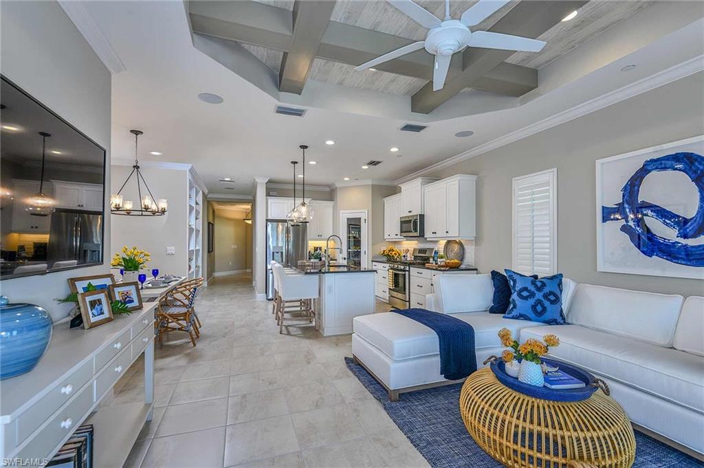 4671 Centaurus Circle Naples, FL 34120 - Photo 12 of 21 a living room with furniture and kitchen view