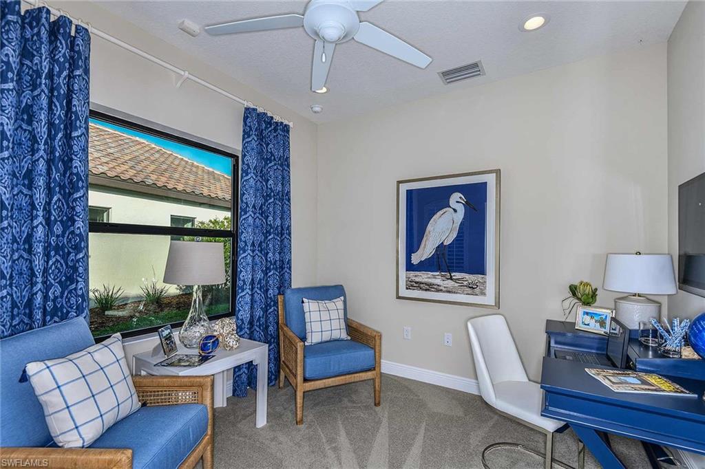 4671 Centaurus Circle Naples, FL 34120 - Photo 19 of 21 a living room with furniture and a large window