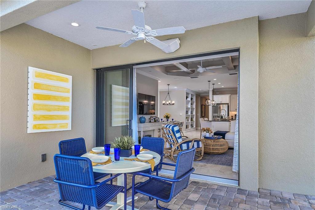 4671 Centaurus Circle Naples, FL 34120 - Photo 21 of 21 a living room with furniture and a table