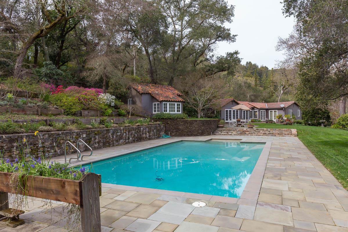 1475 Portola Road Woodside, CA 94062 - Photo 9 of 12 a view of a swimming pool with a patio