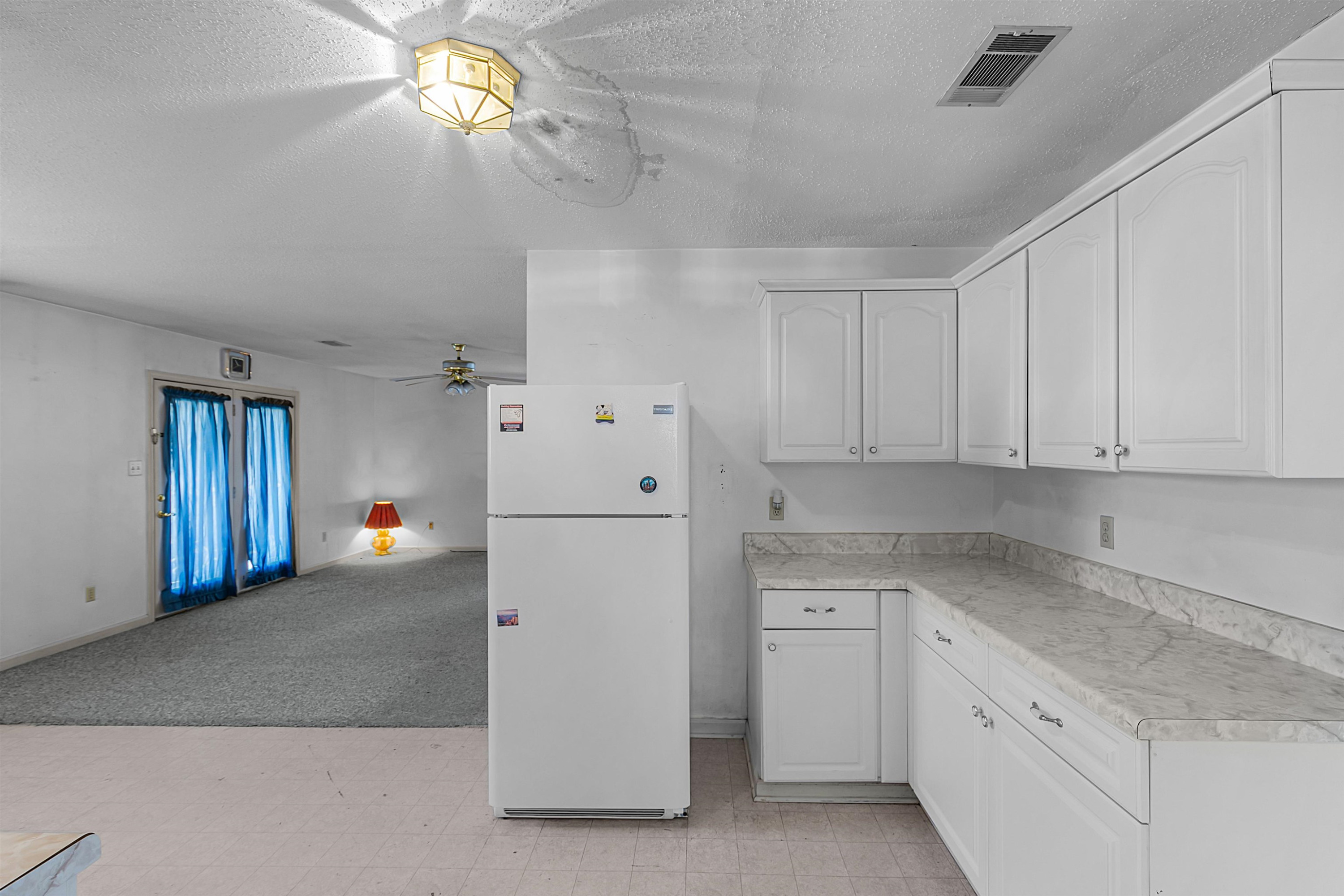 29 Baseline Road Dyer, TN 38330 - Photo 12 of 20 a kitchen with cabinets and white appliances