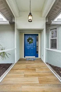 a view of a hallway with a chandelier