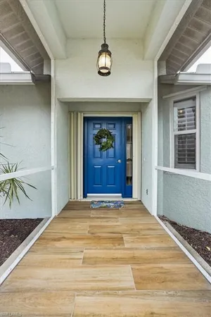 a view of a hallway with a chandelier
