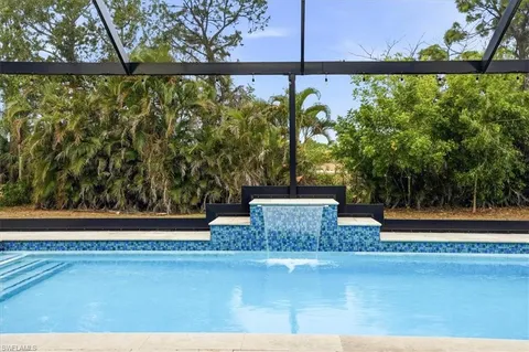 a view of swimming pool with a patio