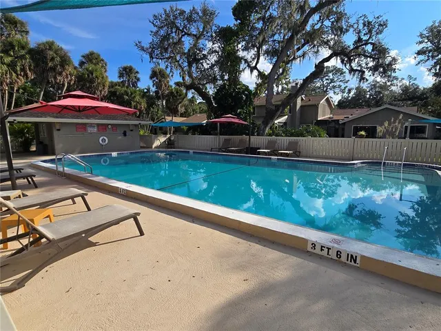 a view of swimming pool with a patio