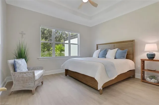 a spacious bedroom with a bed and a couch