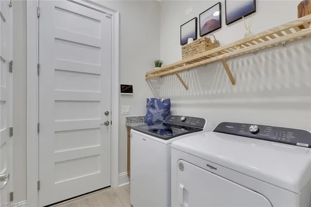 a utility room with dryer and washer