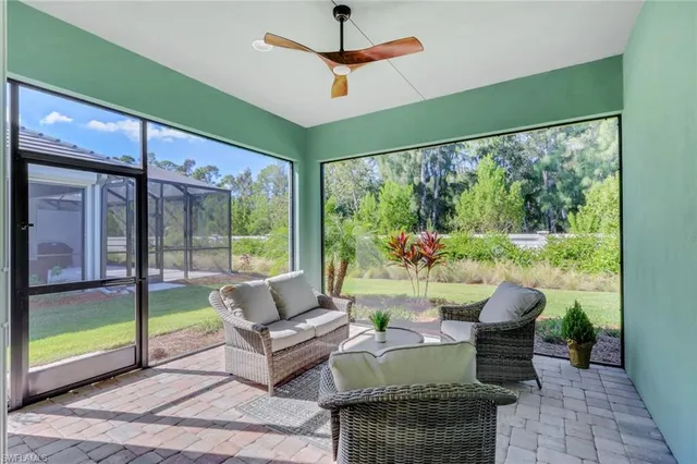 a living room with furniture and a yard