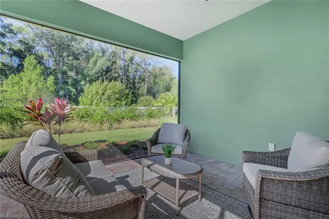 a room with furniture and a large window