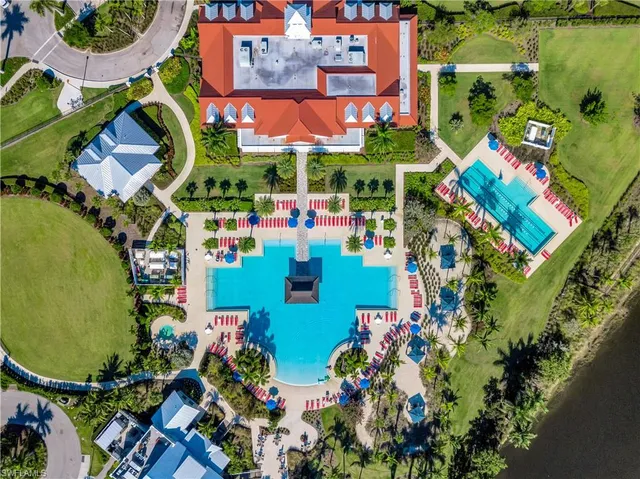a view of a house with a big yard and potted plants