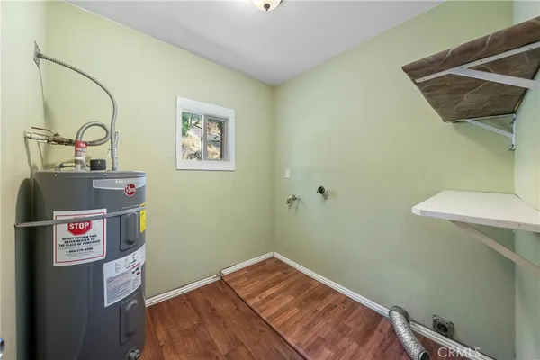 a utility room with a sink dryer and washer