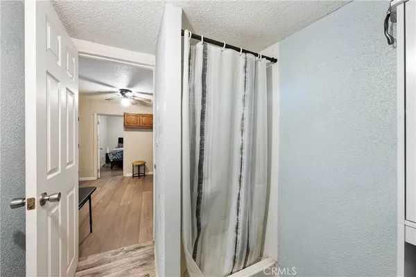 a view of a bathroom with a sink and glass door