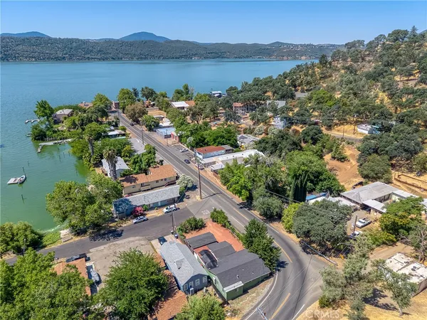 an aerial view of a house with a lake view