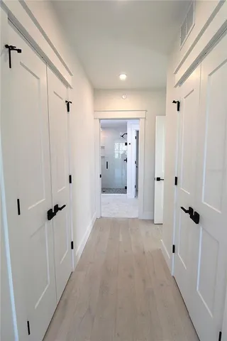 a bathroom with a shower sink and mirror