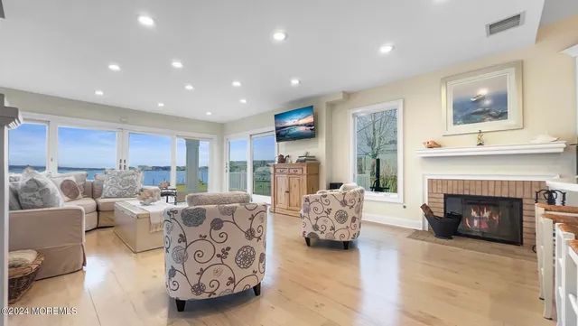 a living room with furniture window and a fireplace