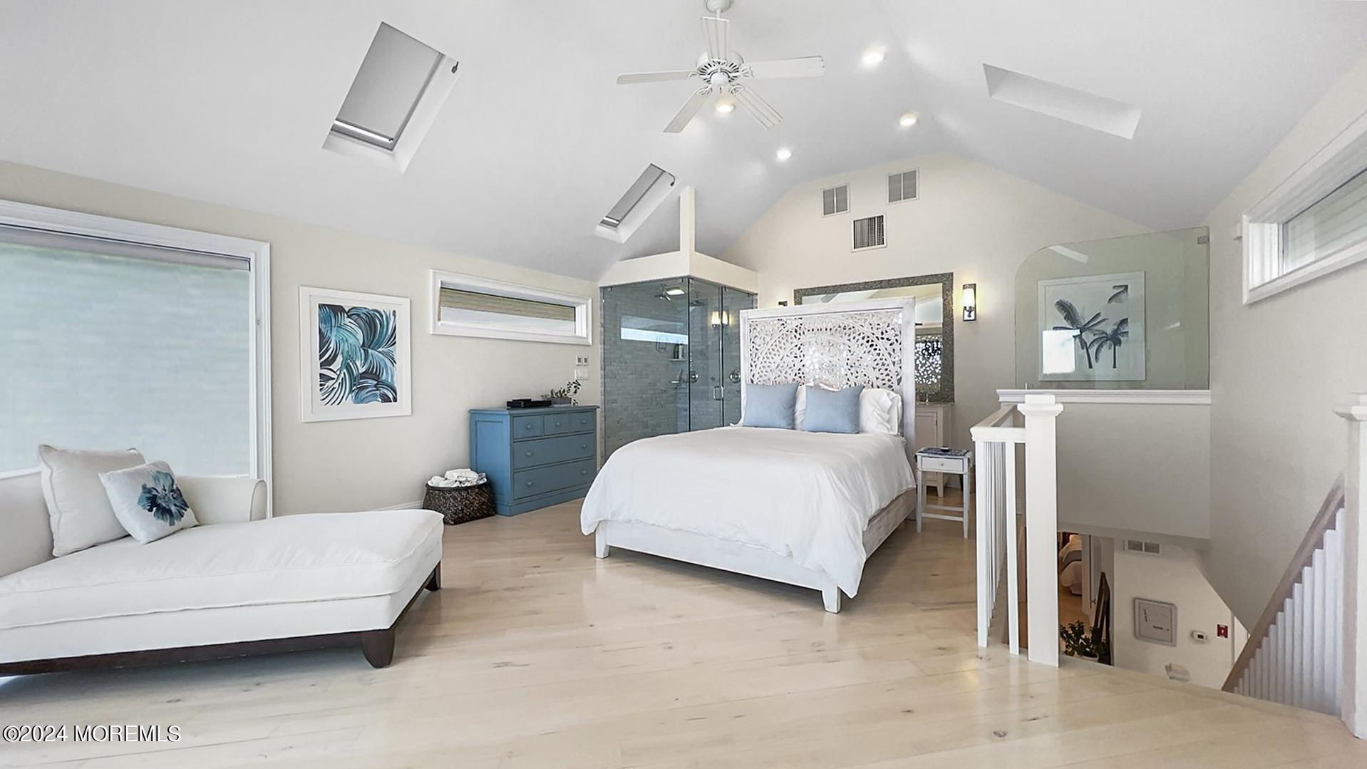 9 Pocano Avenue, Unit A Oceanport, NJ 07757 - Photo 14 of 29 a spacious bedroom with a bed a couch and dresser