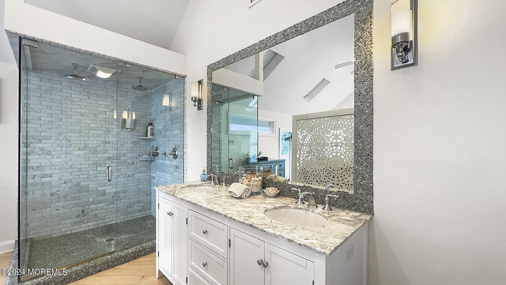 9 Pocano Avenue, Unit A Oceanport, NJ 07757 - Photo 15 of 29 a bathroom with a granite countertop sink a mirror and a shower