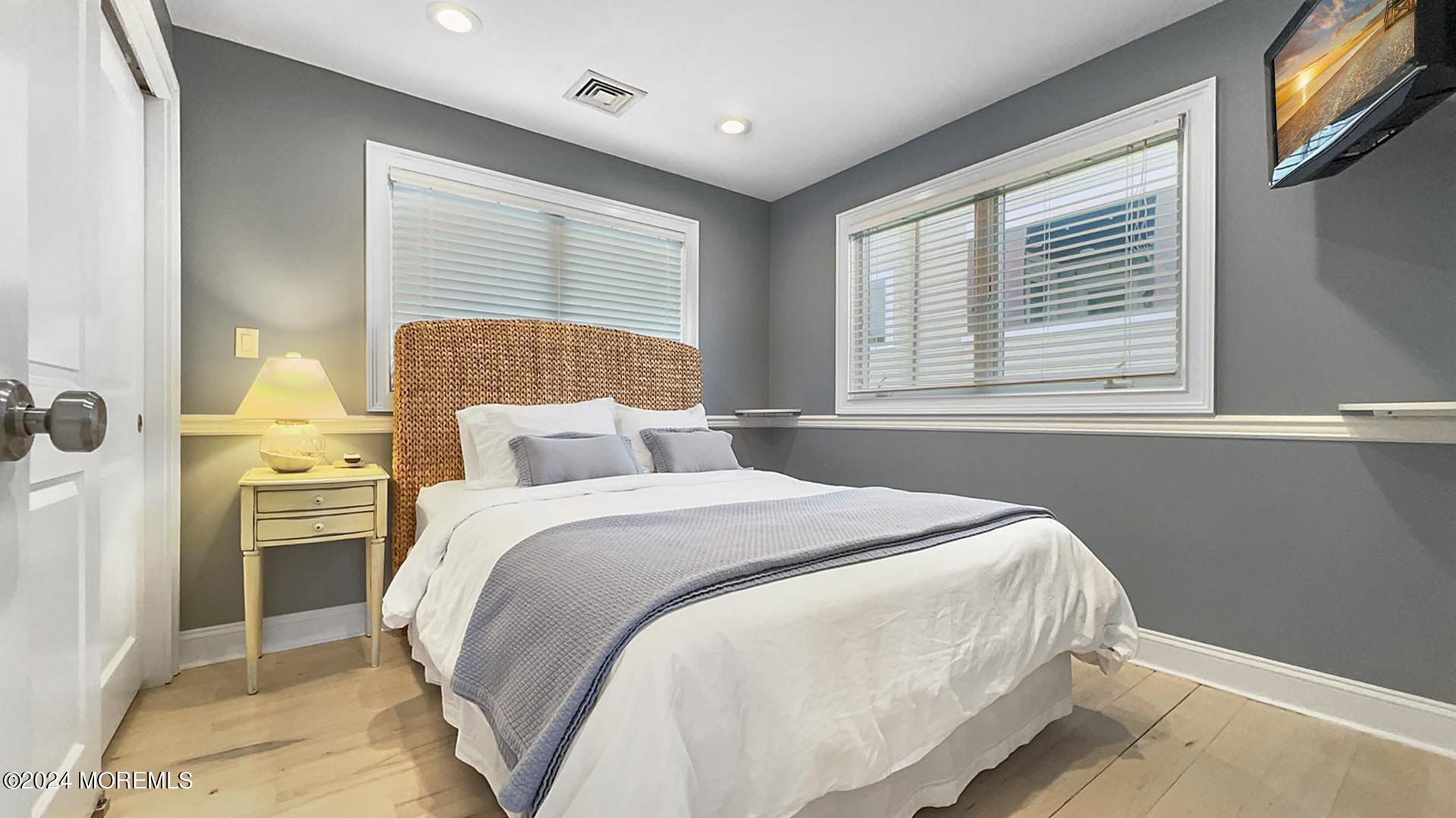 9 Pocano Avenue, Unit A Oceanport, NJ 07757 - Photo 18 of 29 a bedroom with a bed and a window